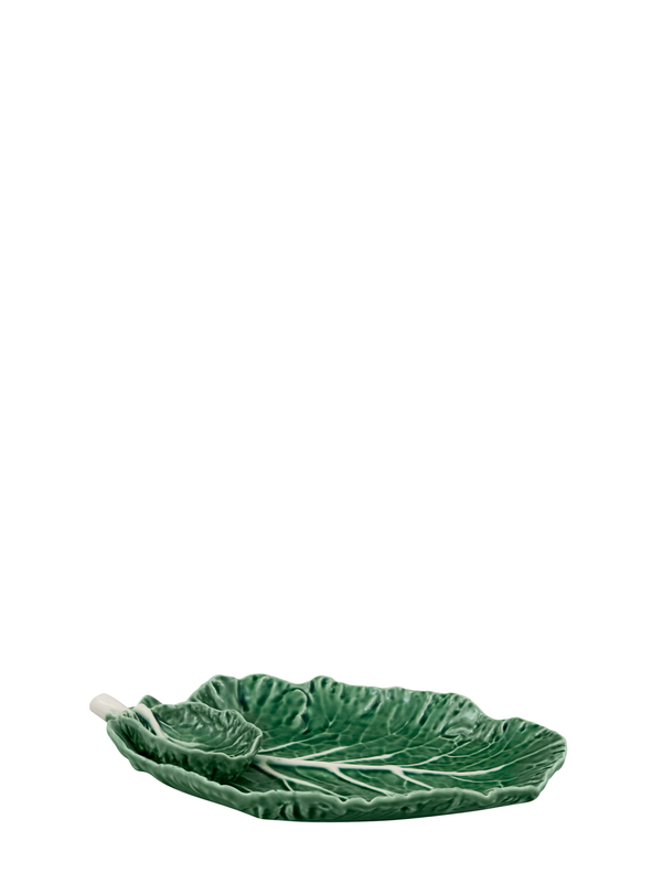 A green earthenware serving dish designed to resemble a cabbage leaf, with a smaller leaf-shaped bowl attached.