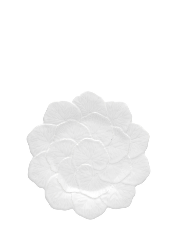A white ceramic serving dish designed to resemble a flower, with a smooth texture and a rounded shape.