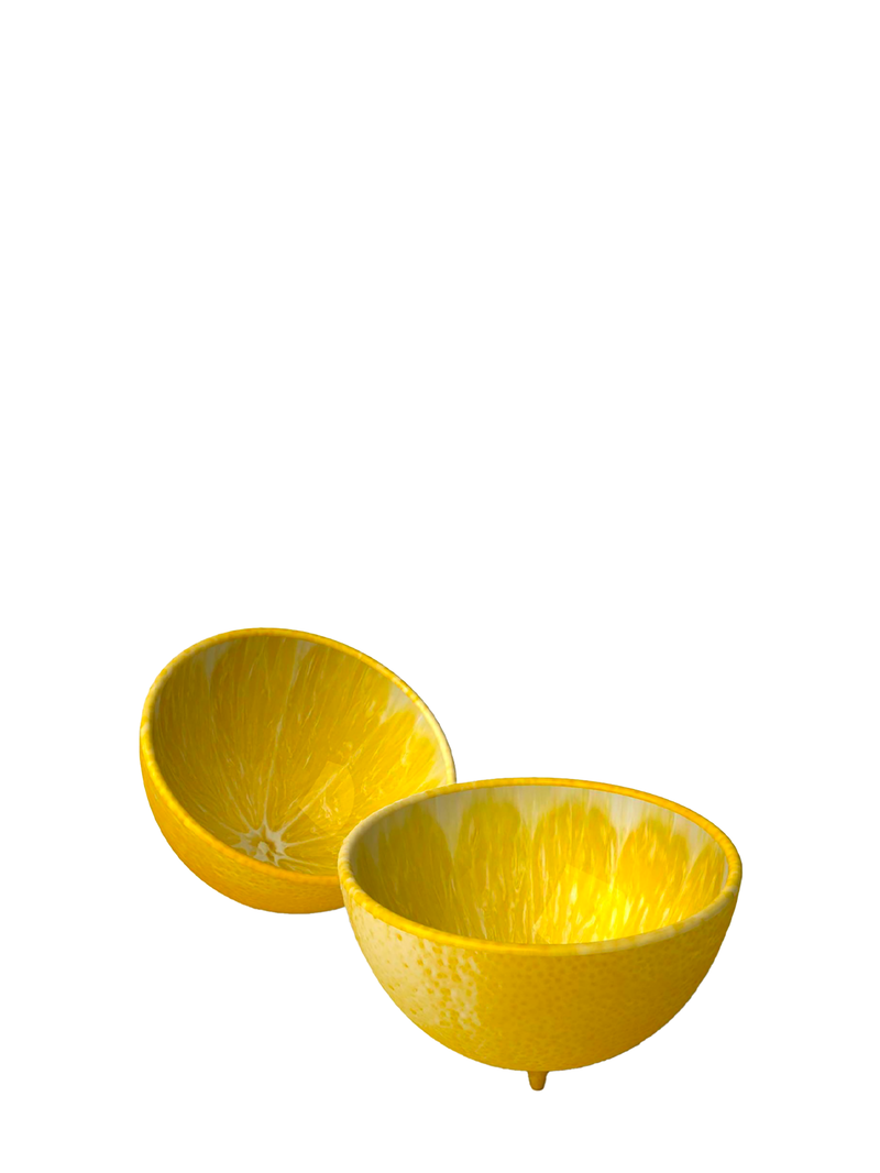 A vibrant yellow lemon ceramic bowl designed to resemble a halved lemon, with a textured interior and exterior.