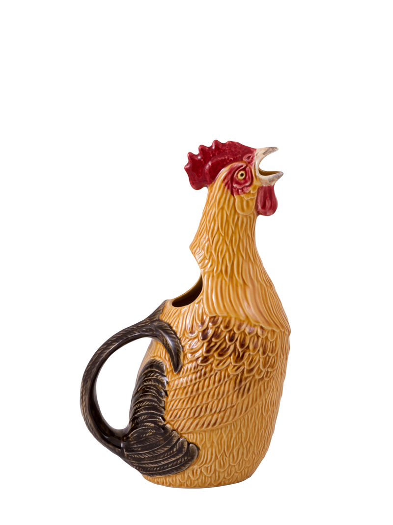 A ceramic pitcher in the shape of a rooster with a yellow beak, red wattle, and a black neck, set against a white background.
