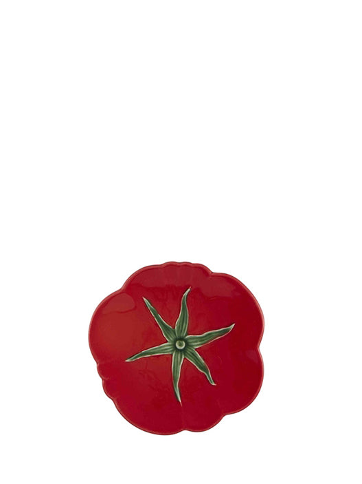 A red earthenware side plate designed to resemble a tomato, with a visible green stem.