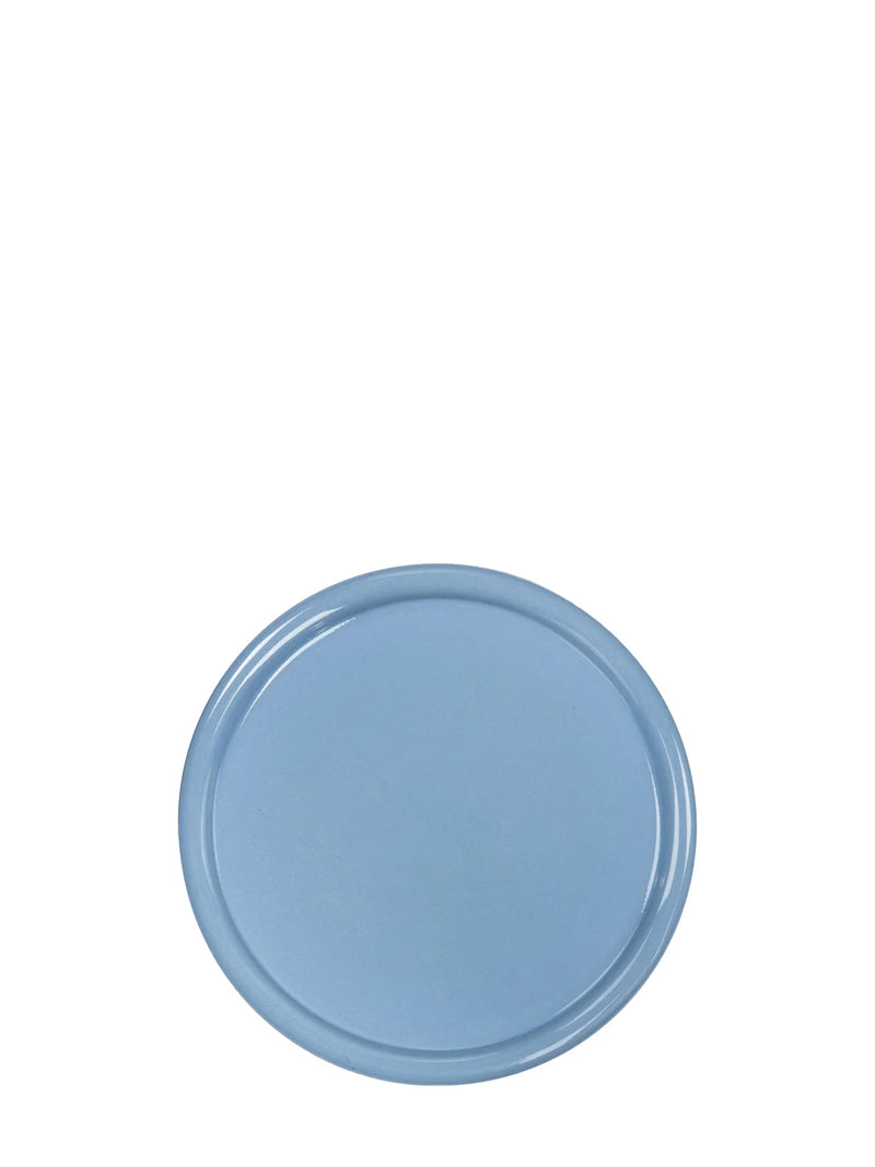 Round blue ceramic plate with round rim on a white background