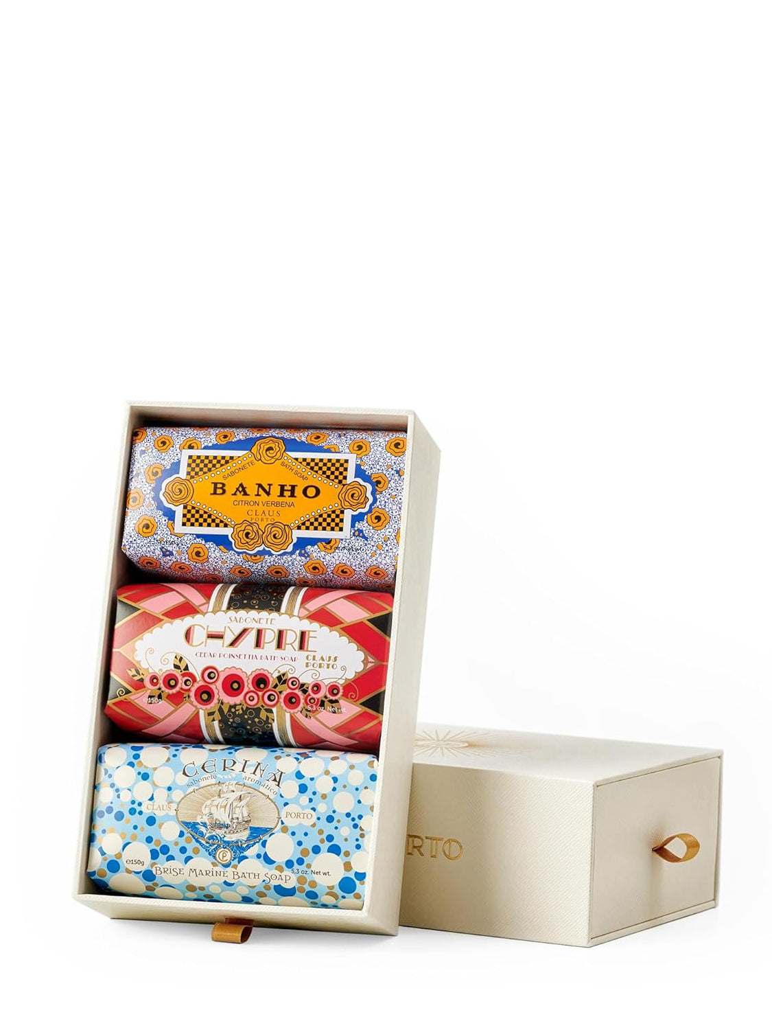 Set of three soaps in decorative boxes with visible branding on a white background