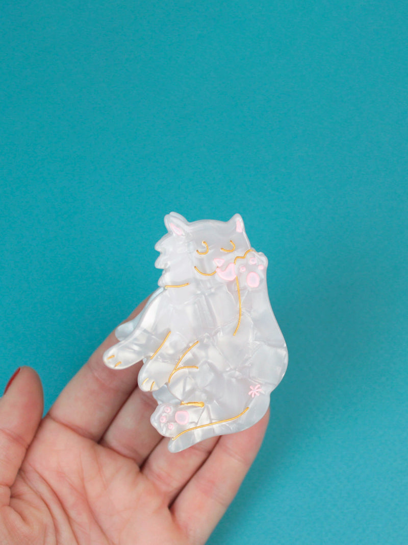 White cat hair claw