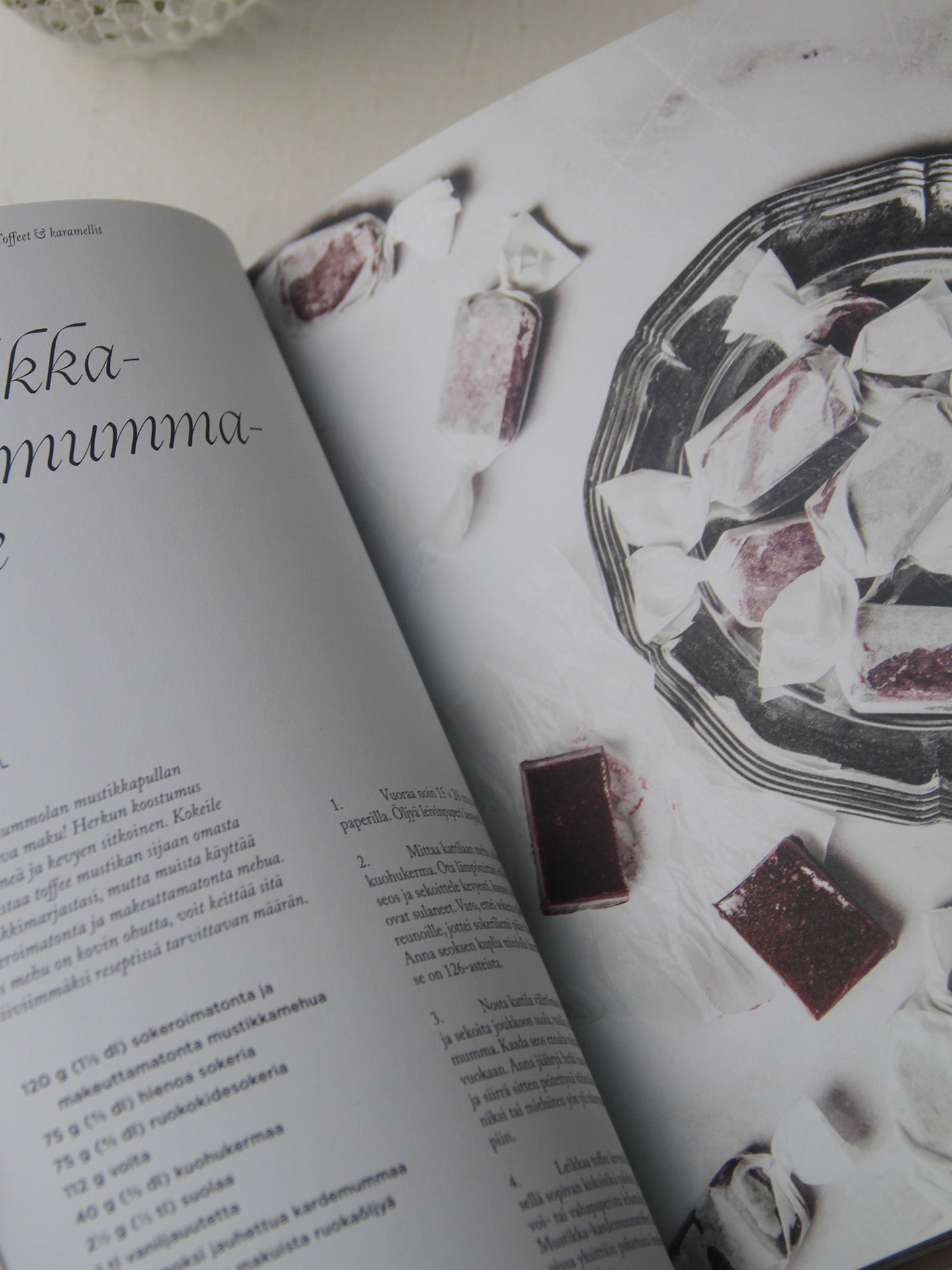 Open book with a page featuring images of confectionery items.