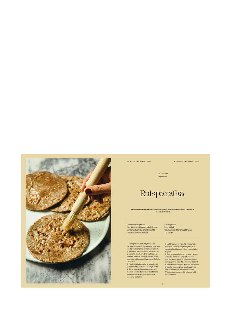 A printed recipe spread page for Ruisparatha, featuring a photo of prepared flatbreads on a plate with a rolling pin on the left, and the recipe text on a beige background on the right.