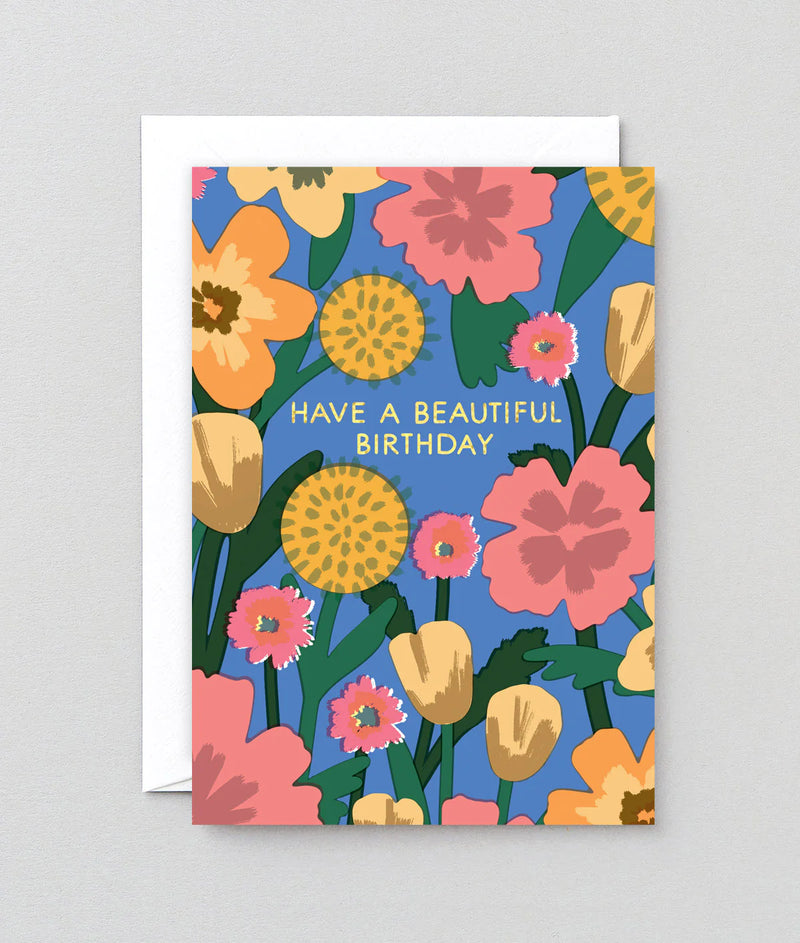 Floral birthday card with colorful flowers and text on a gray background