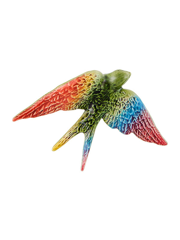 pride-coloured swallow figurine on a white background