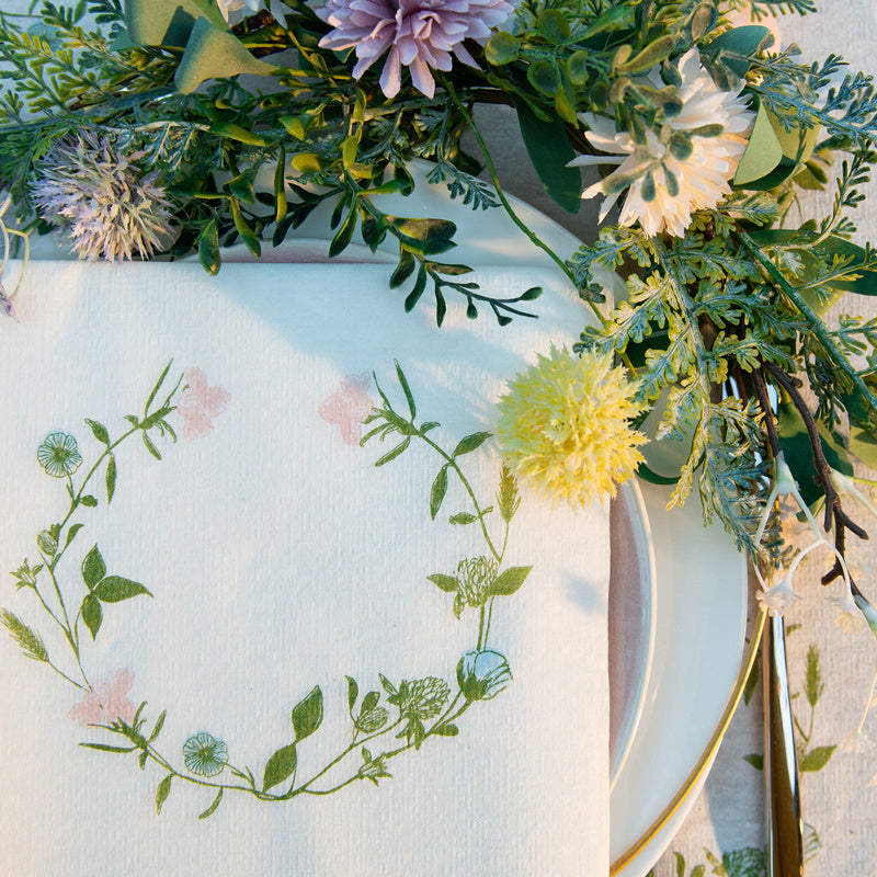 Decorative table setting with floral elements on a white plate.