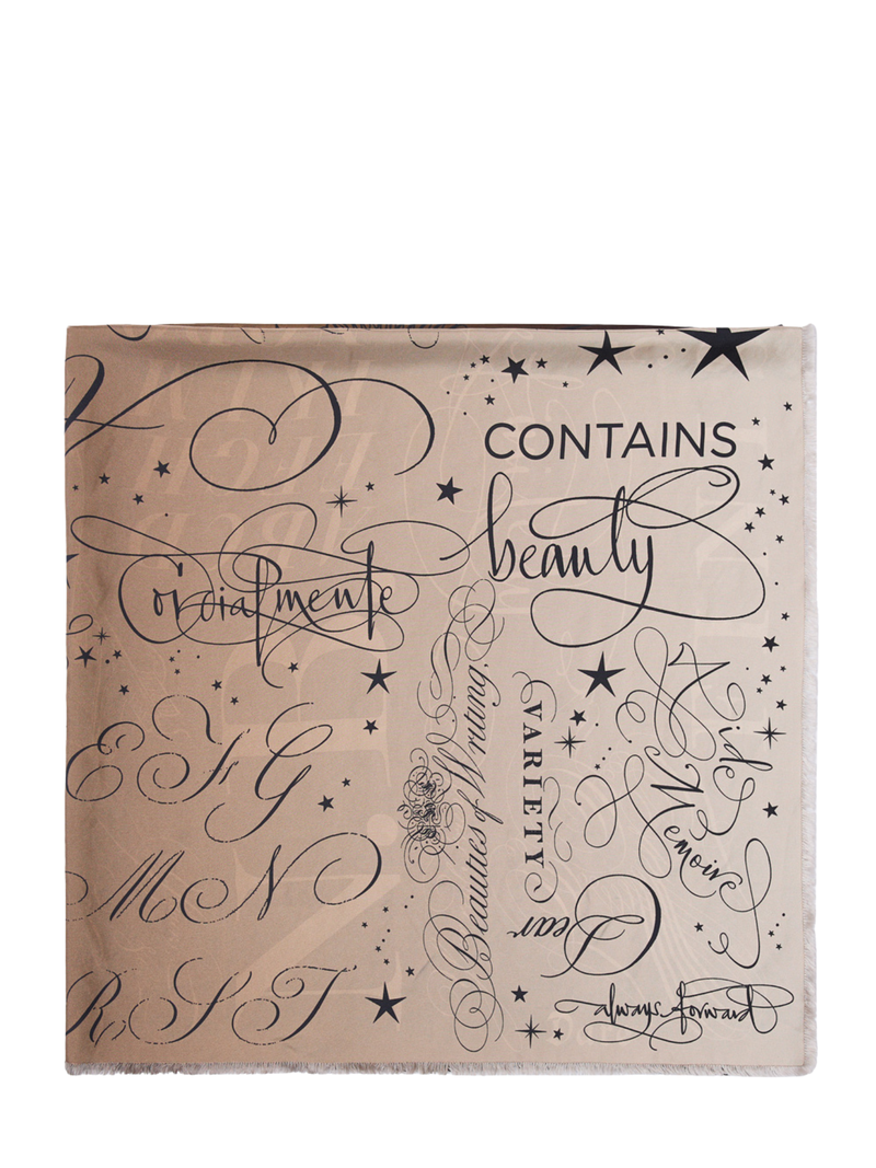 Beige silk scarf with black text and star patterns on a white background