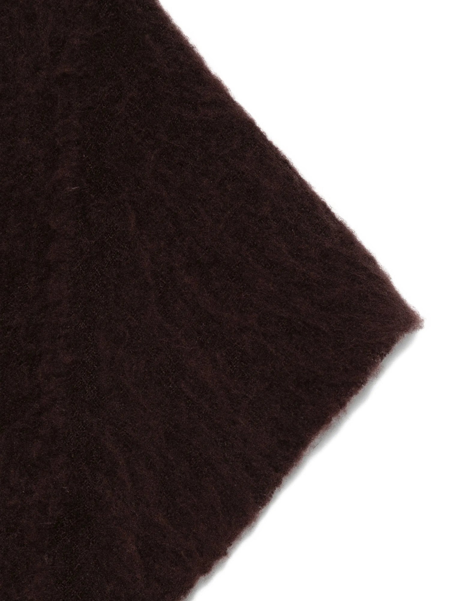 Close-up of a brown fabric texture on a white background