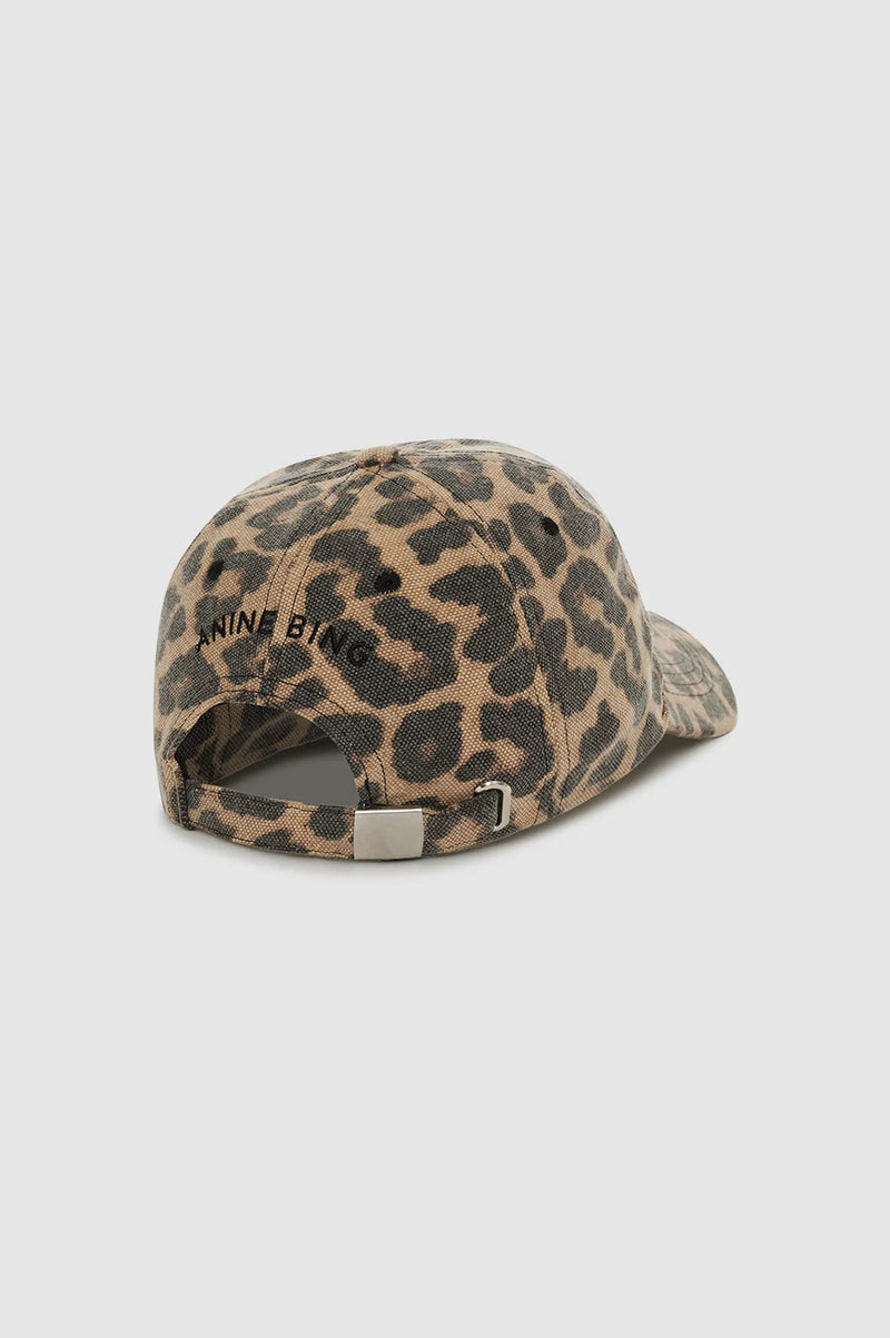 Leopard print cap with 'Nine Line' branding on a light gray background