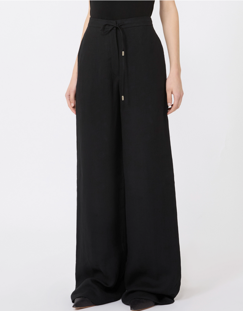 Black wide-leg pants worn by a person on a white background