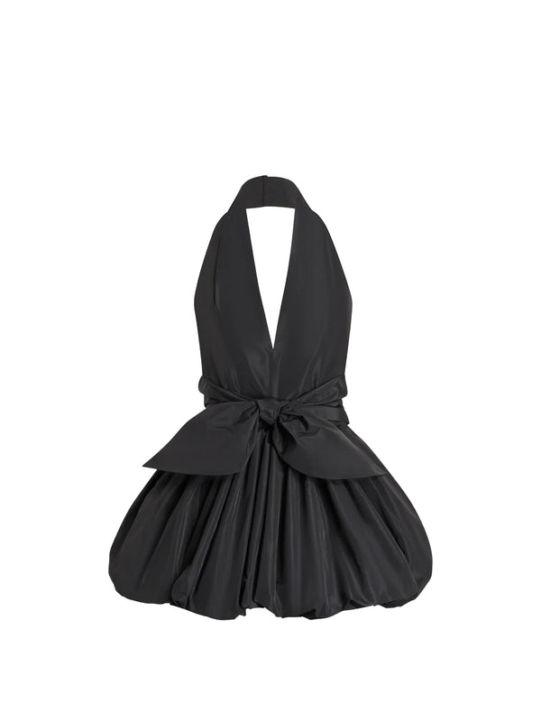 Black halter dress with a bow detail on a white background
