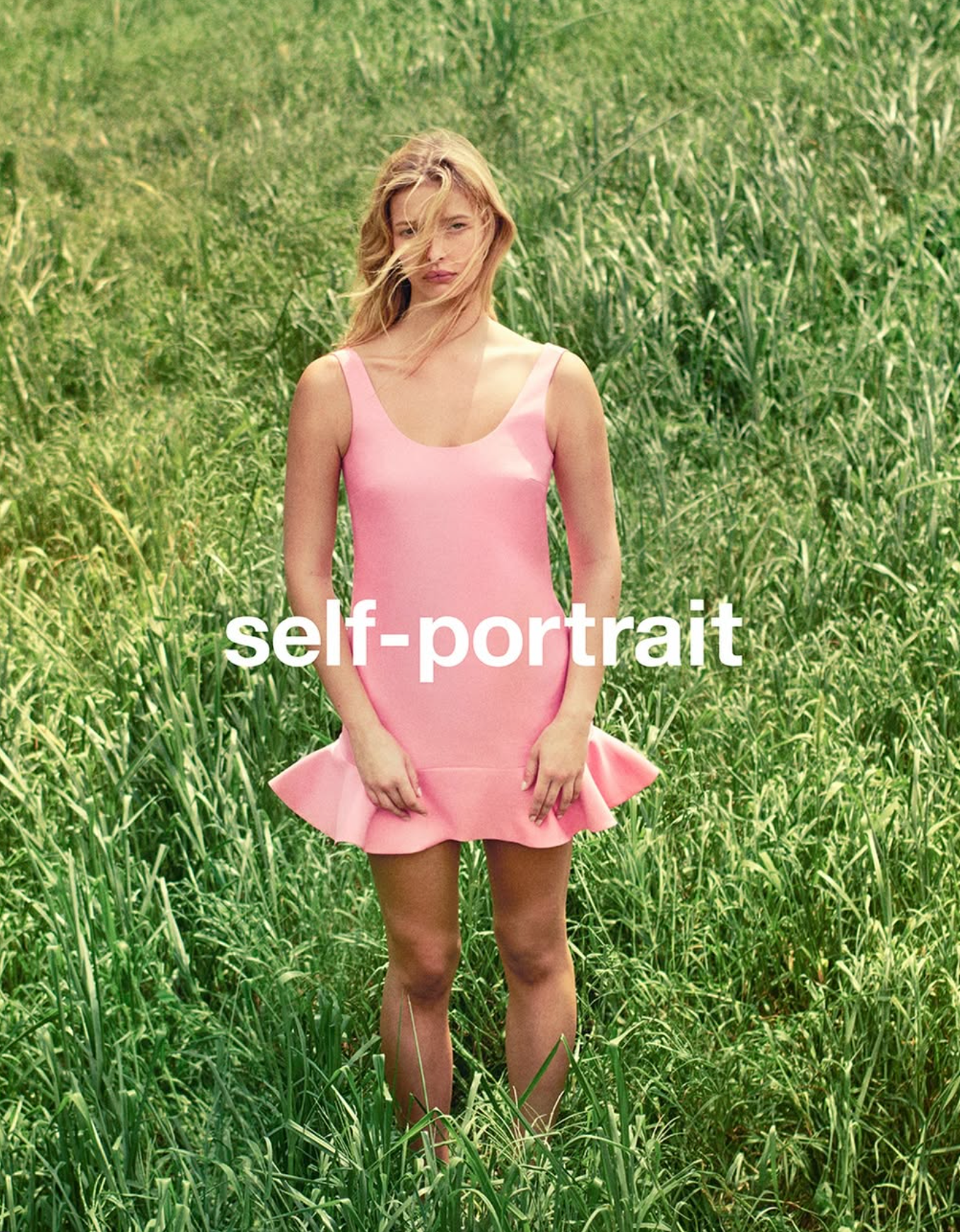 Woman in a pink dress standing in a grassy field with 'self-portrait' text overlay.