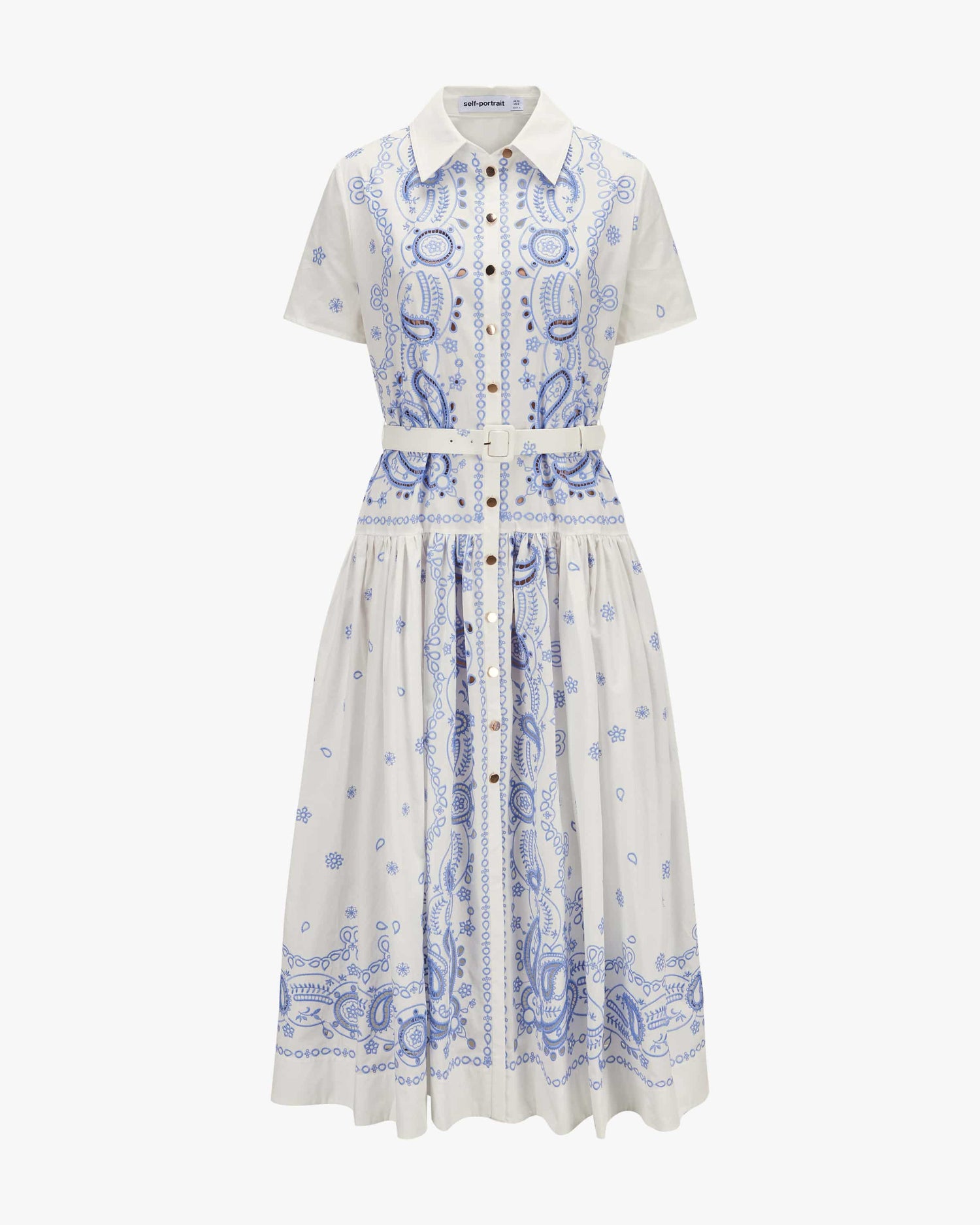 White dress with blue paisley pattern on a white background