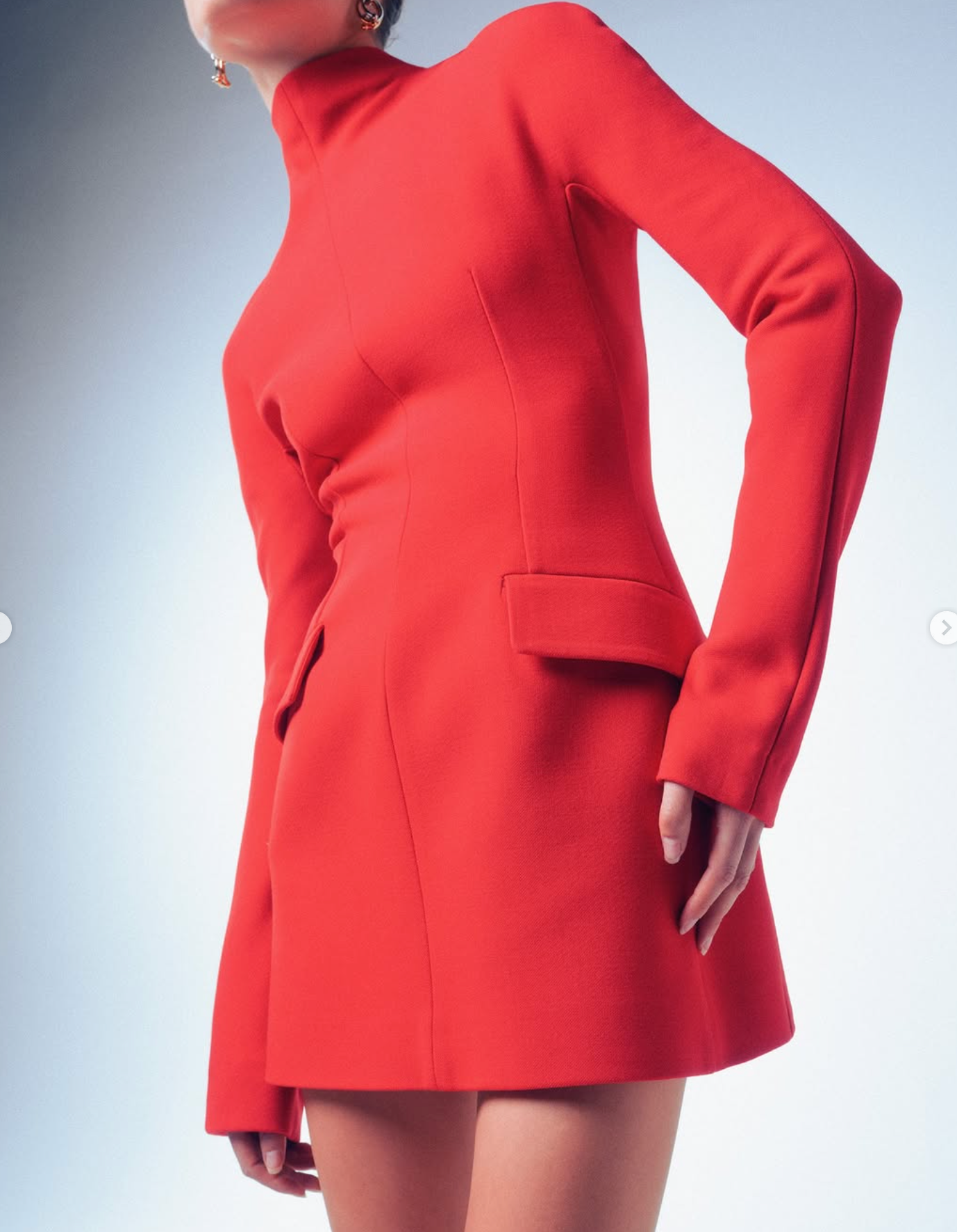 Red dress worn by a person on a light gray background