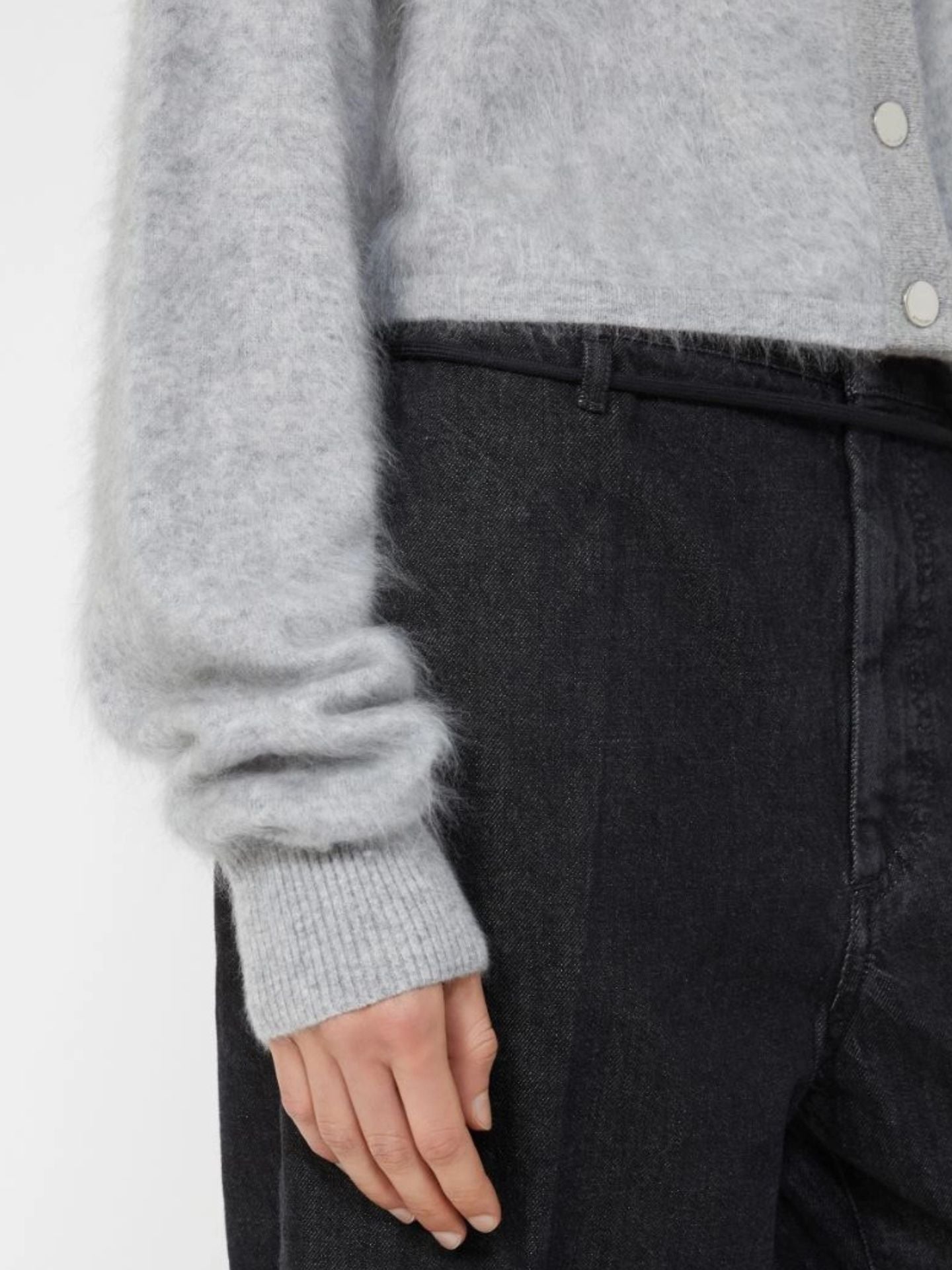 Gray sweater and dark pants on a white background