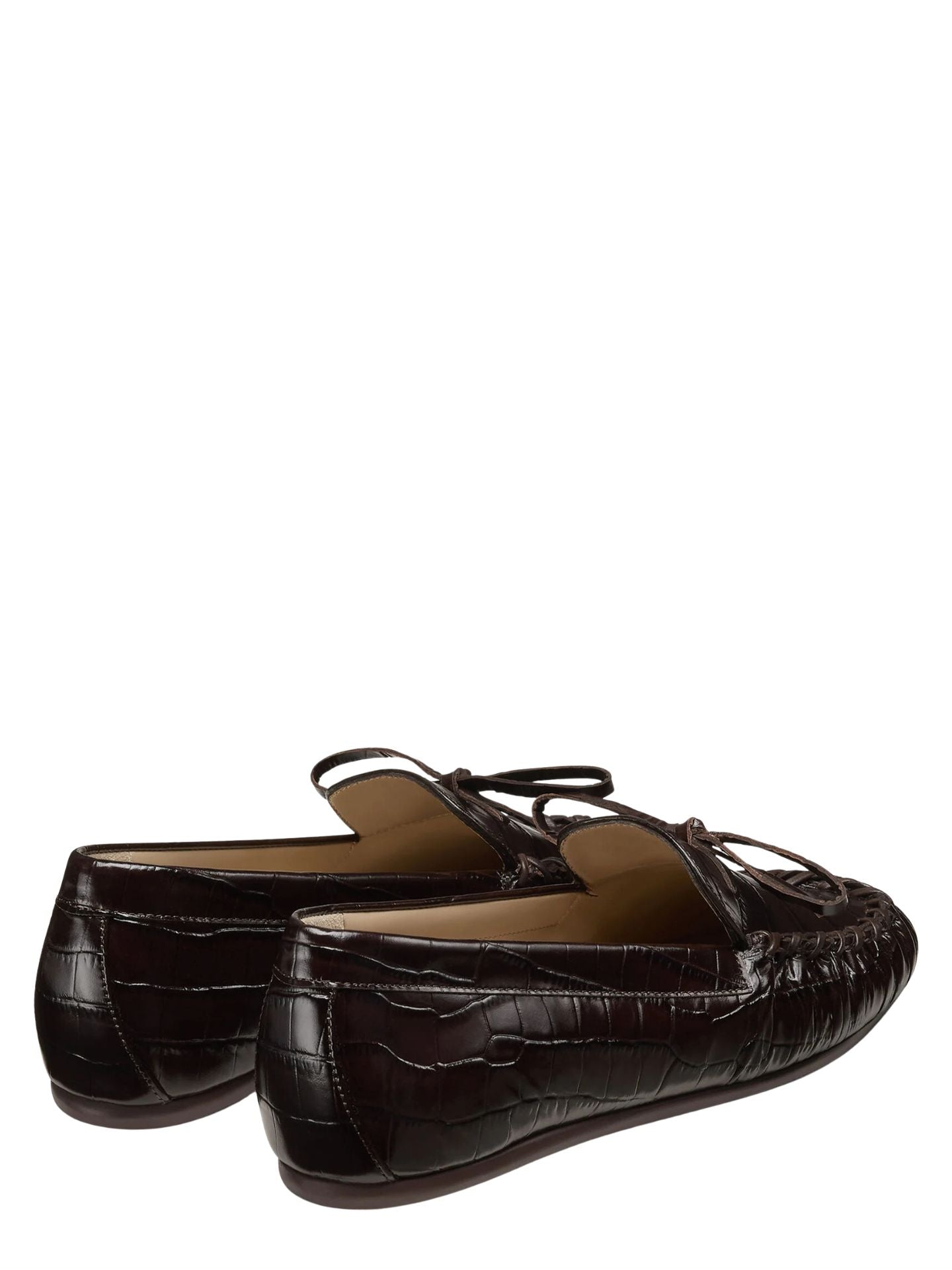 Brown leather loafer shoe on a white background