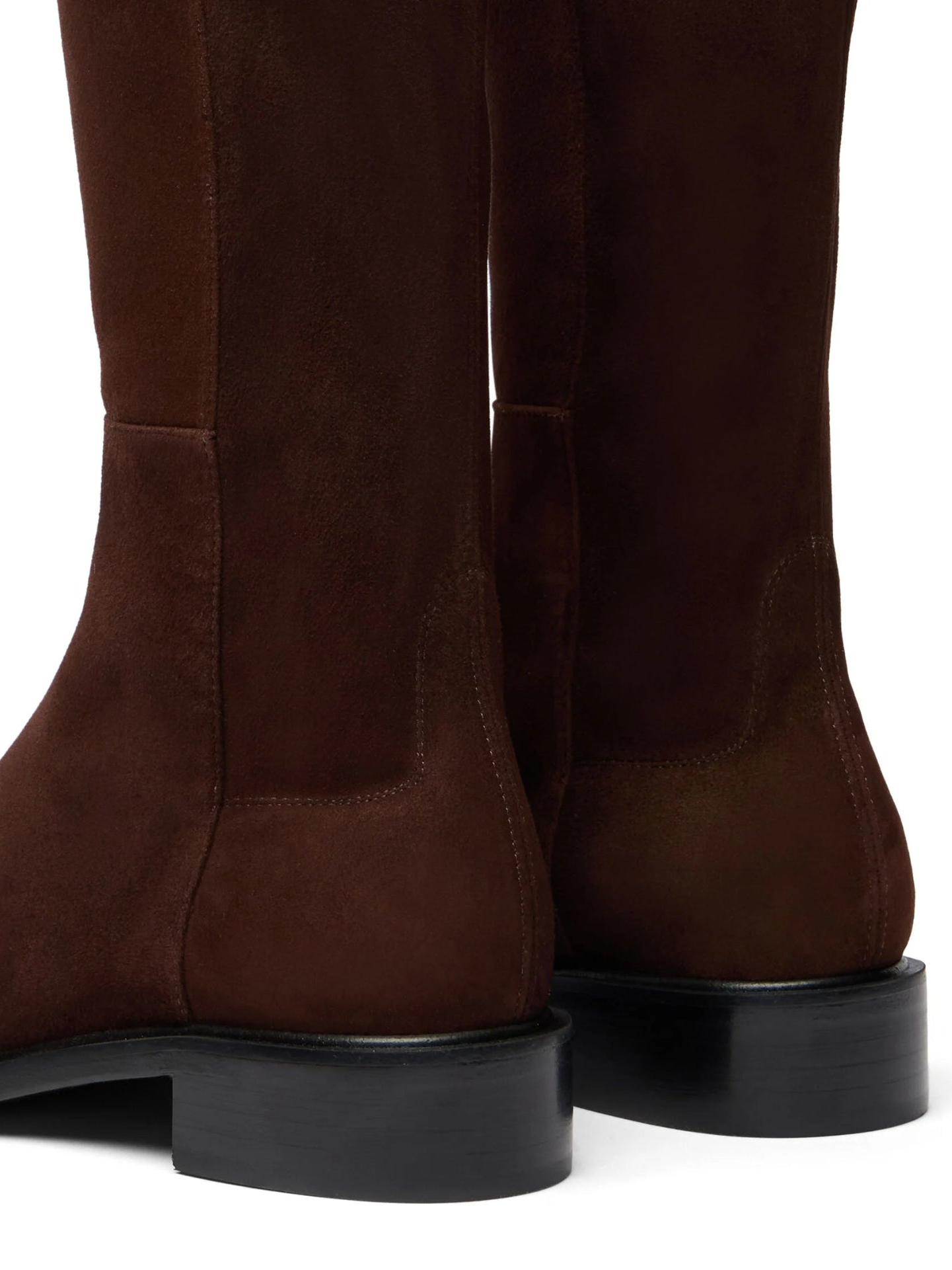 Brown knee-high boots on a white background