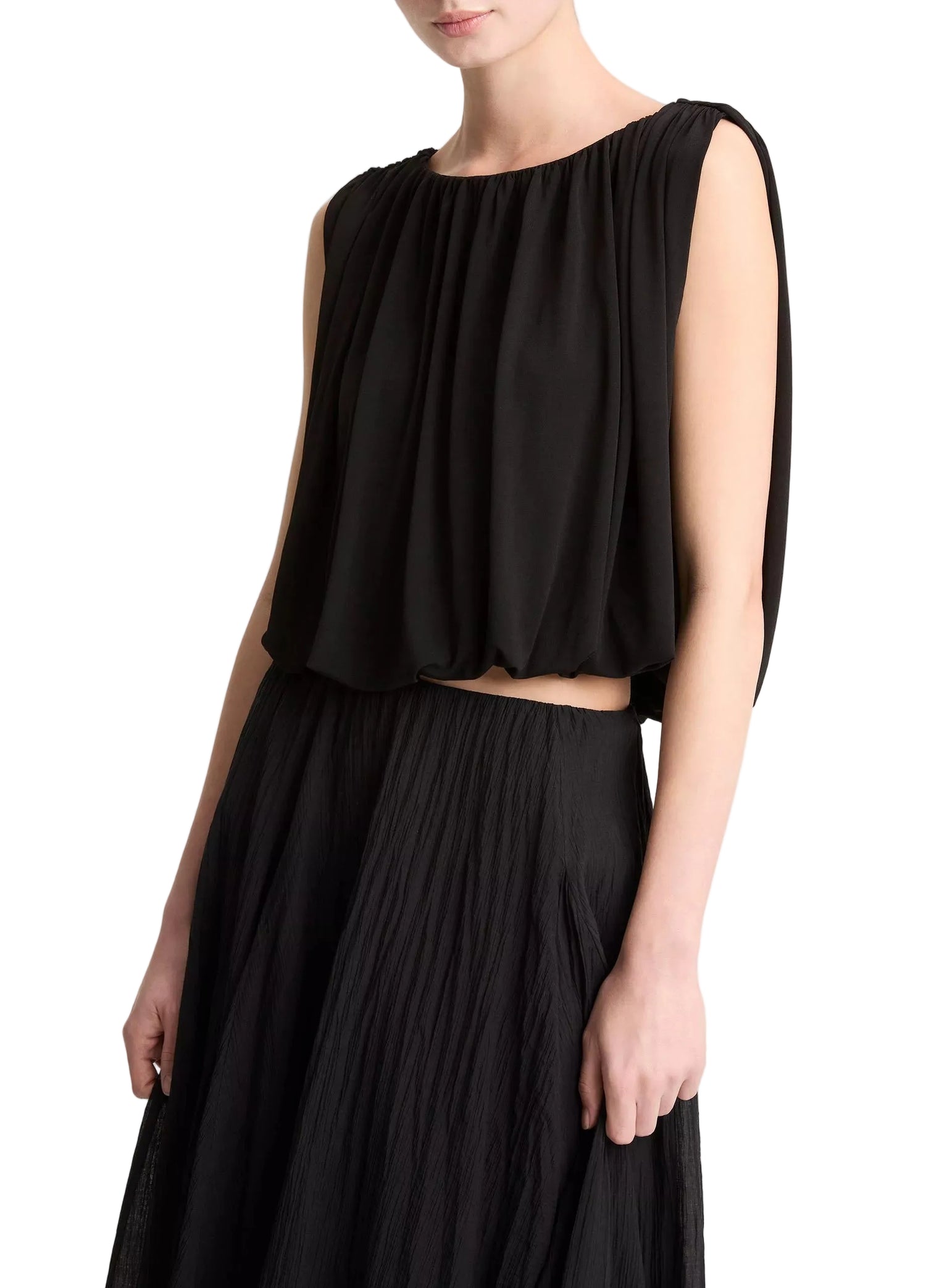 Black sleeveless top and skirt set on a plain background