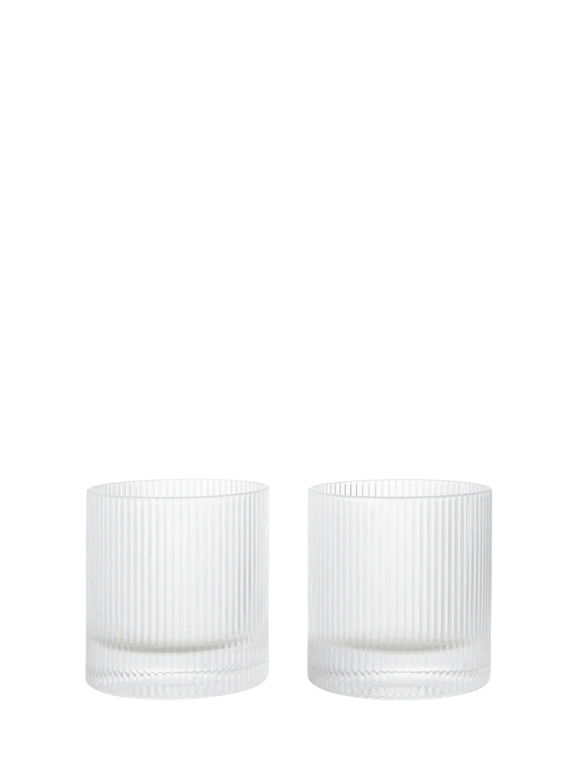 Two clear ribbed glass tumblers from Ferm Living's Ripple series on a white background
