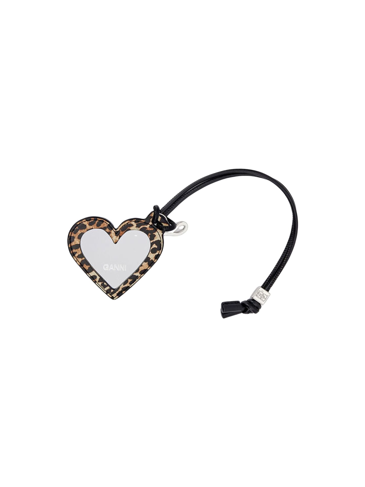 Heart-shaped mirror with leopard print border on a white background