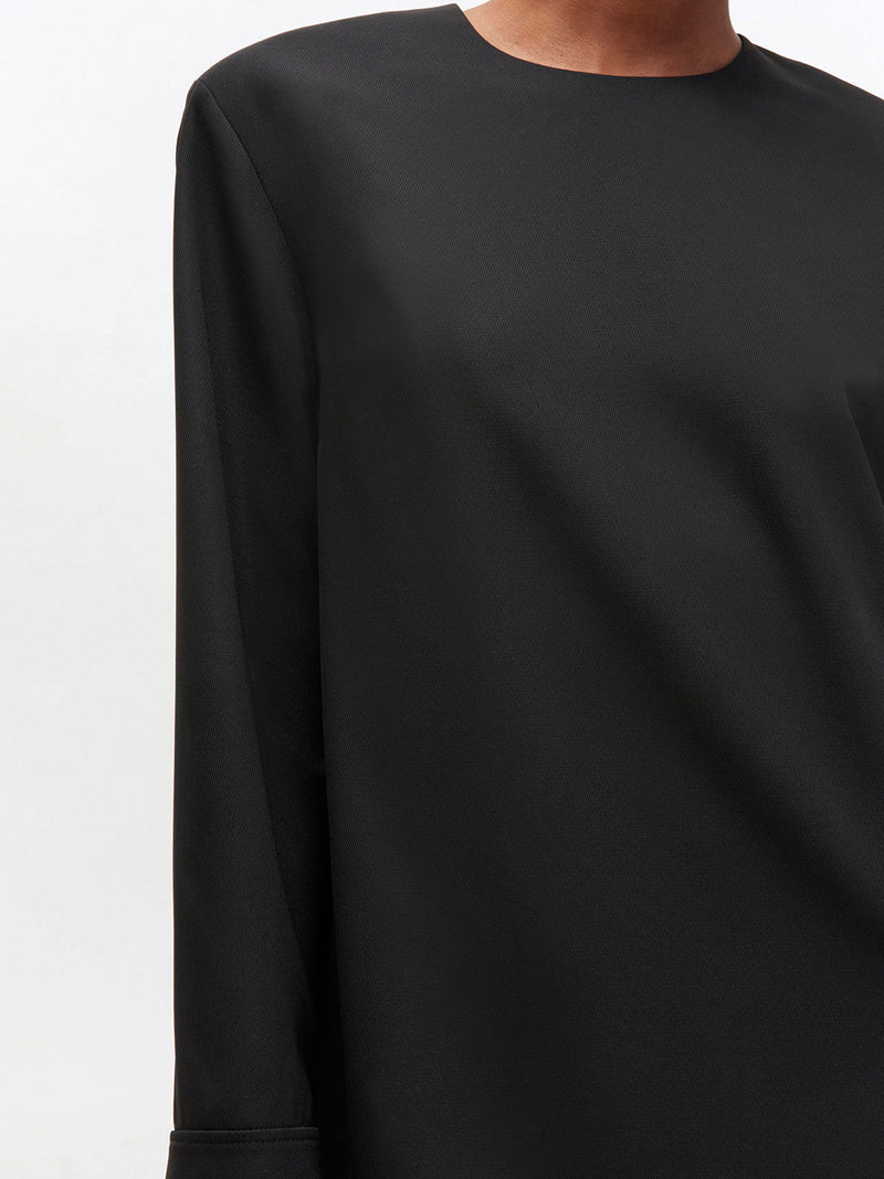 Black long-sleeve dress on a white background