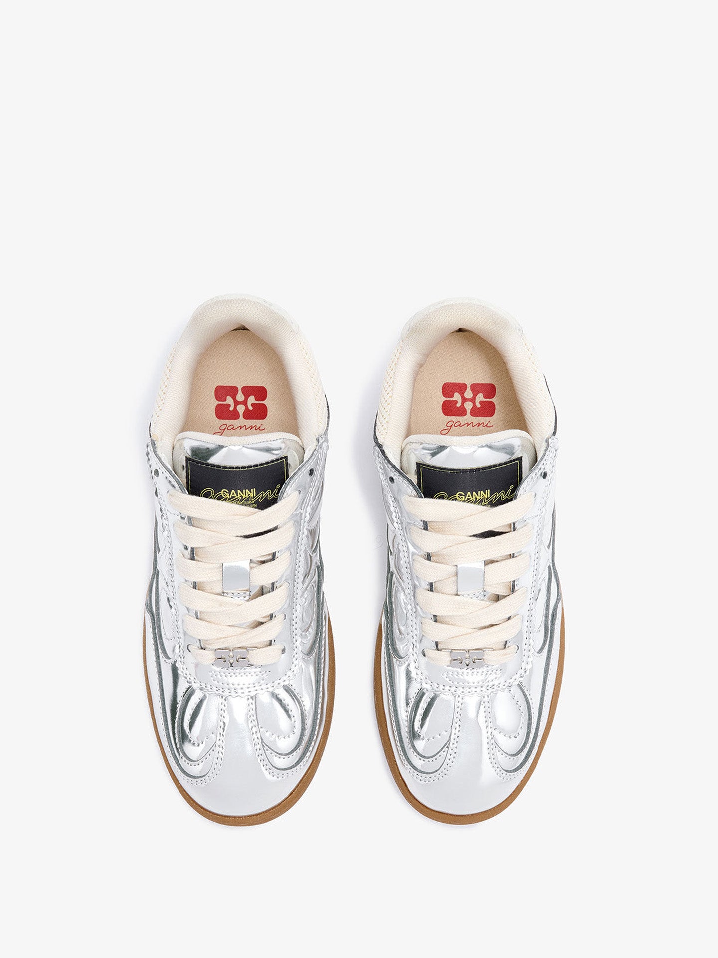 Pair of white sneakers with brand logo on a white background