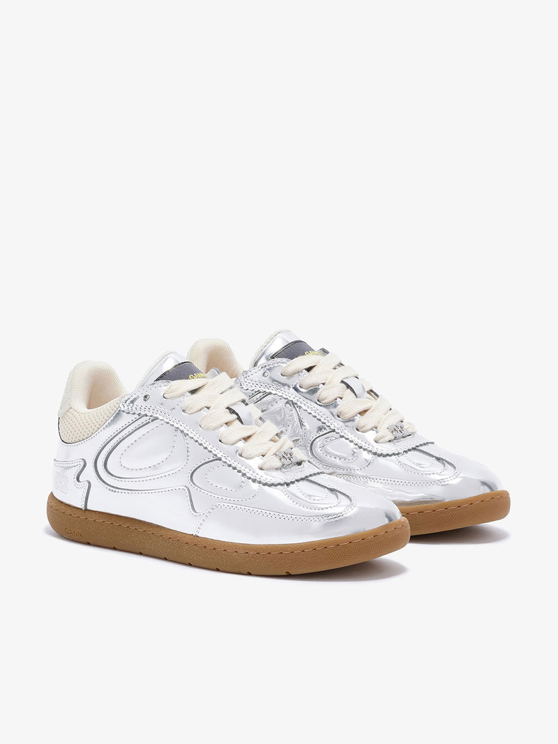White sneakers with brown soles on a white background