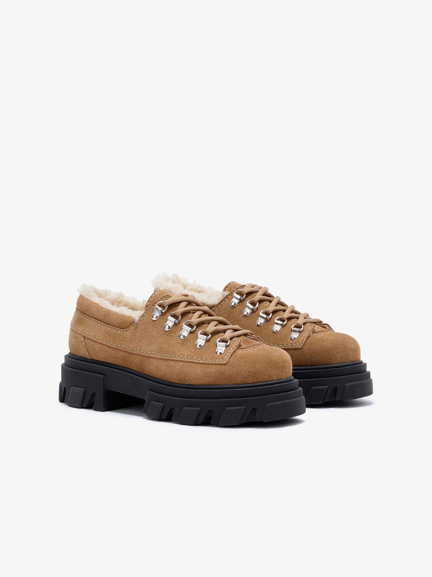 Cognac shoe with black sole on a white background