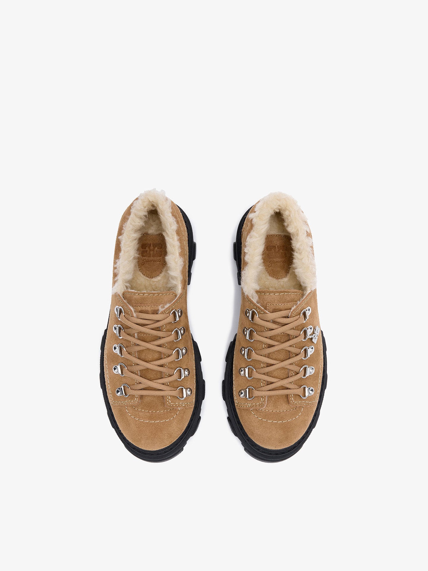 Cognac shoe with black sole on a white background