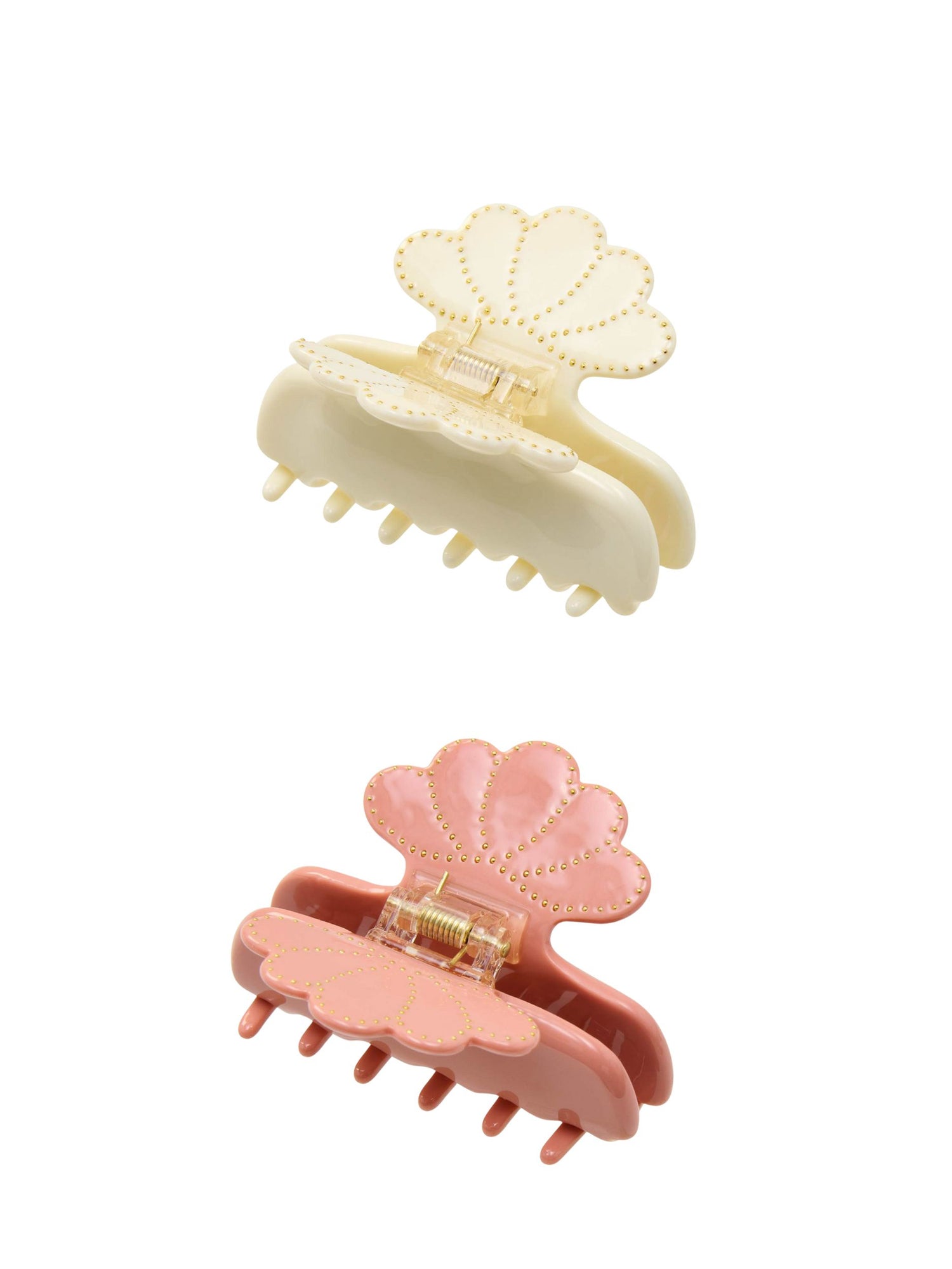 Two shell-shaped hair clips, one beige and one pink, on a white background.