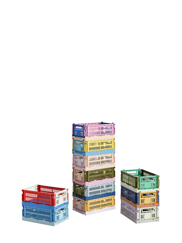 Stacked multicolored plastic storage crates with a perforated design.