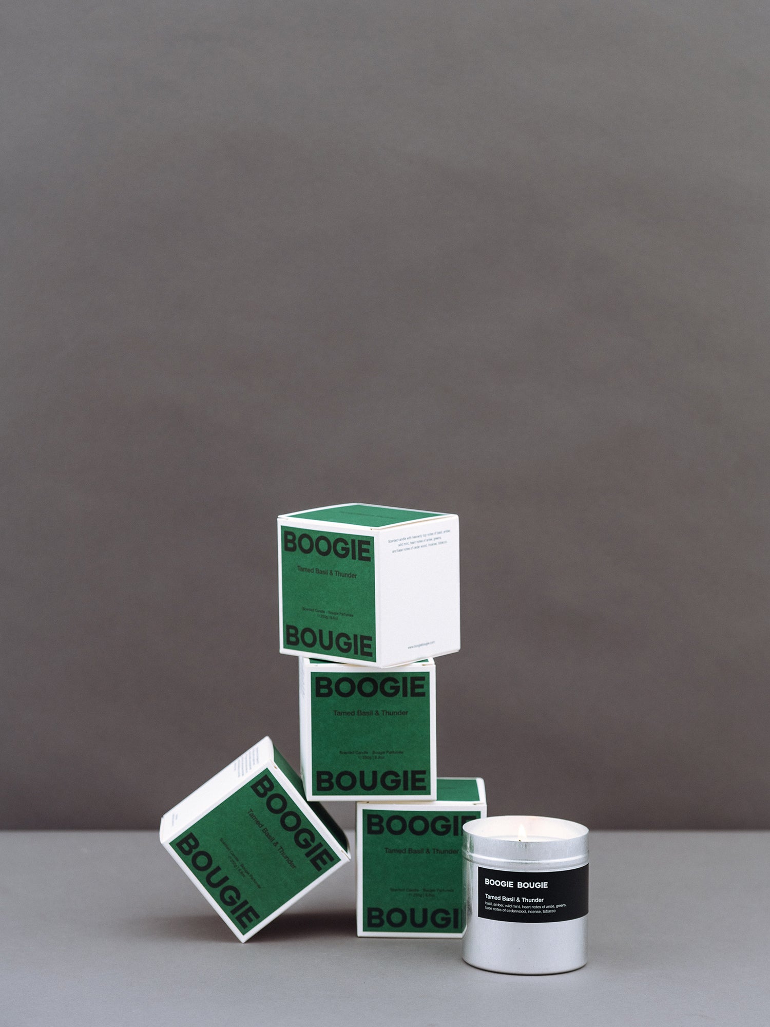Green and white containers with 'BOOGIE BOUGIE' branding on a gray background