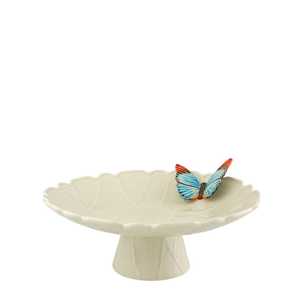 Decorative ceramic cake stand with a blue butterfly by Bordallo Pinheiro on a white background