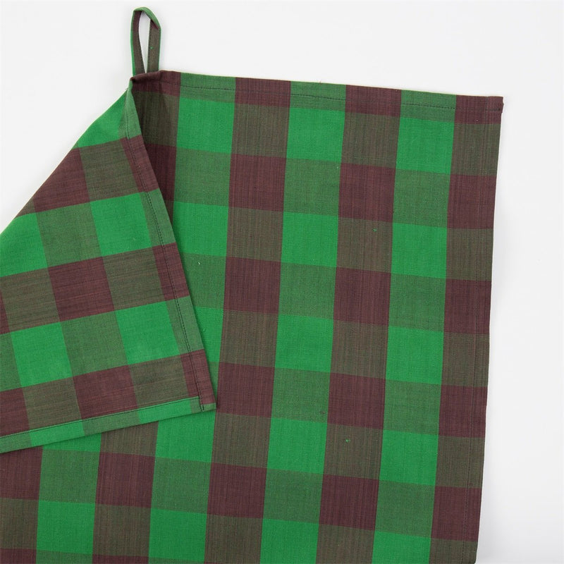 Green and red checkered fabric on a white background
