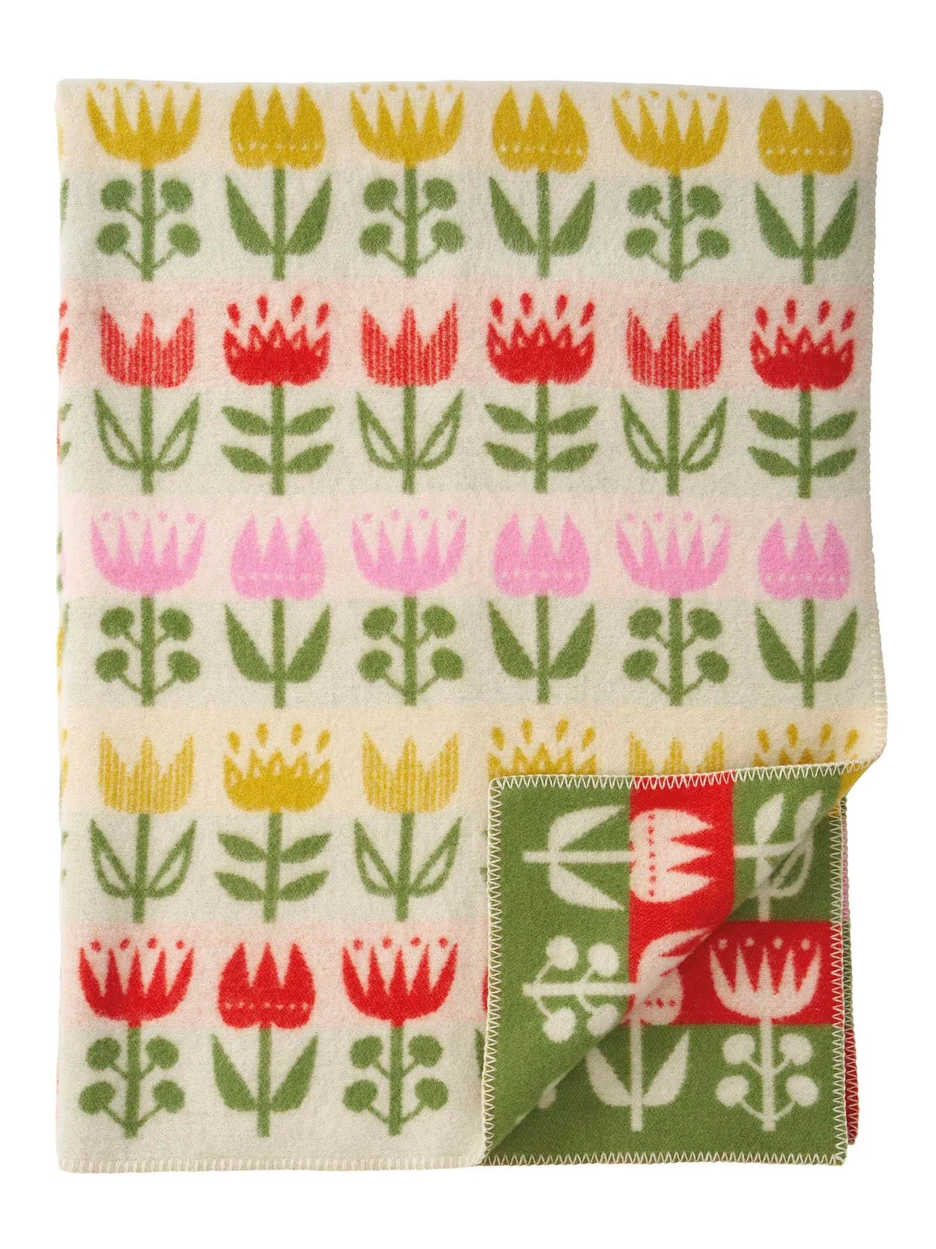 Tulip patterned wool throw with a folded corner on a white background