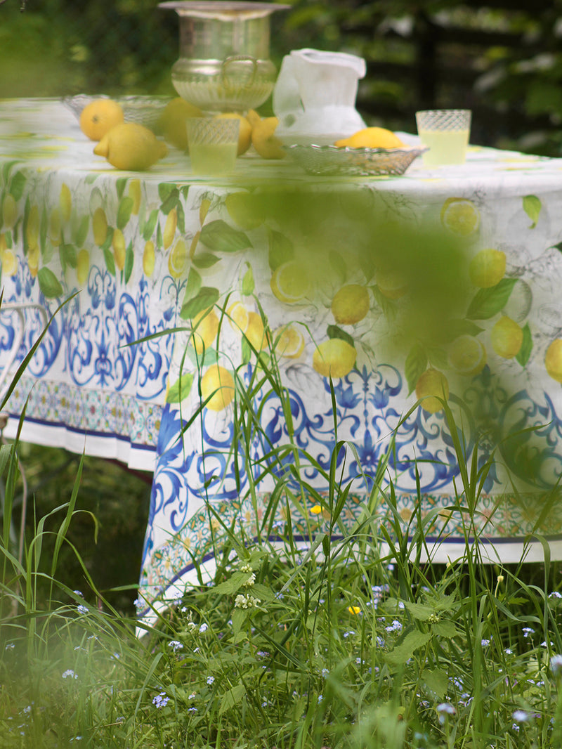 Tablecloth with lemon design in a garden setting