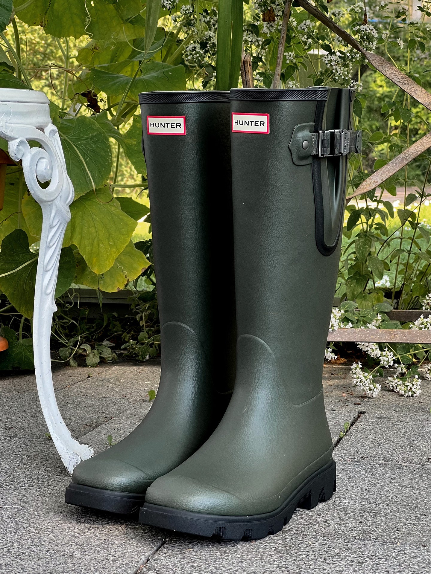 Green tall Hunter rubber boots are great for example on a stone surface on the greenhouse.
