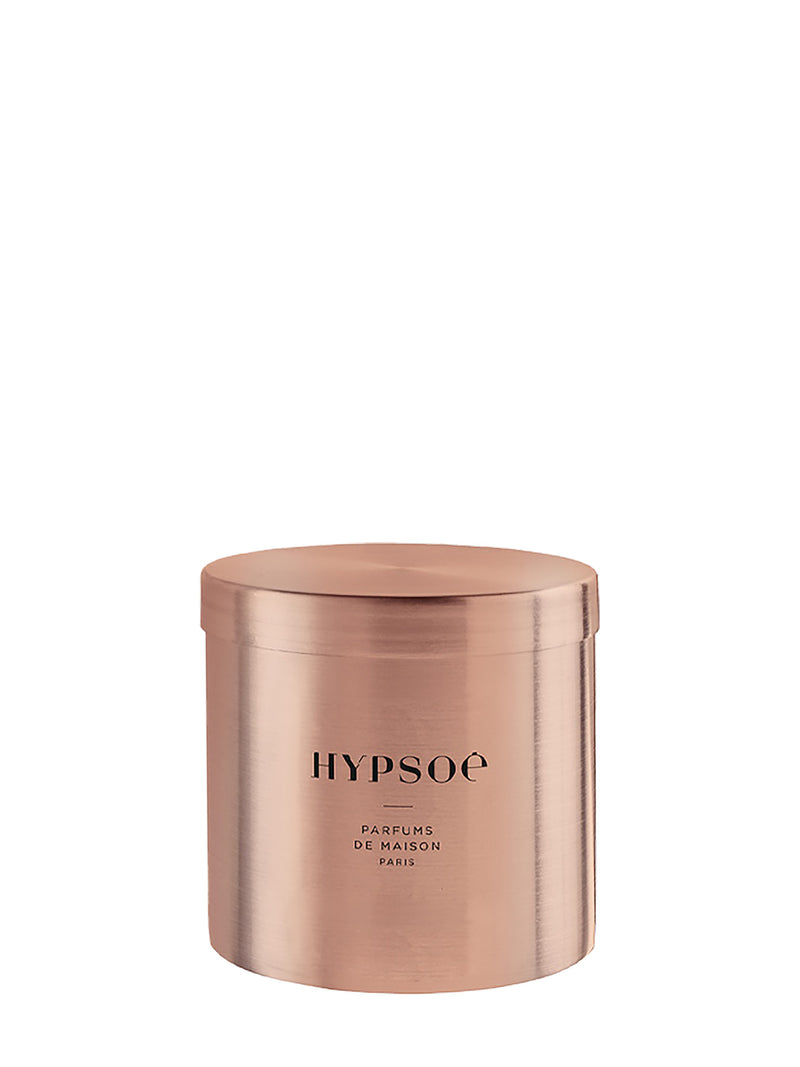 A shiny cylindrical metallic copper jar candle with a matching lid, featuring the brand name 'HYPSOE' printed in black on the front and 'PARFUMS DE MAISON PARIS' under it.