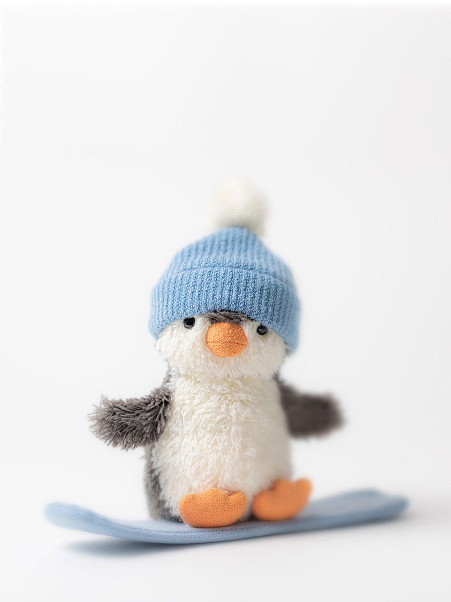 Peanut Penguin snowboarding