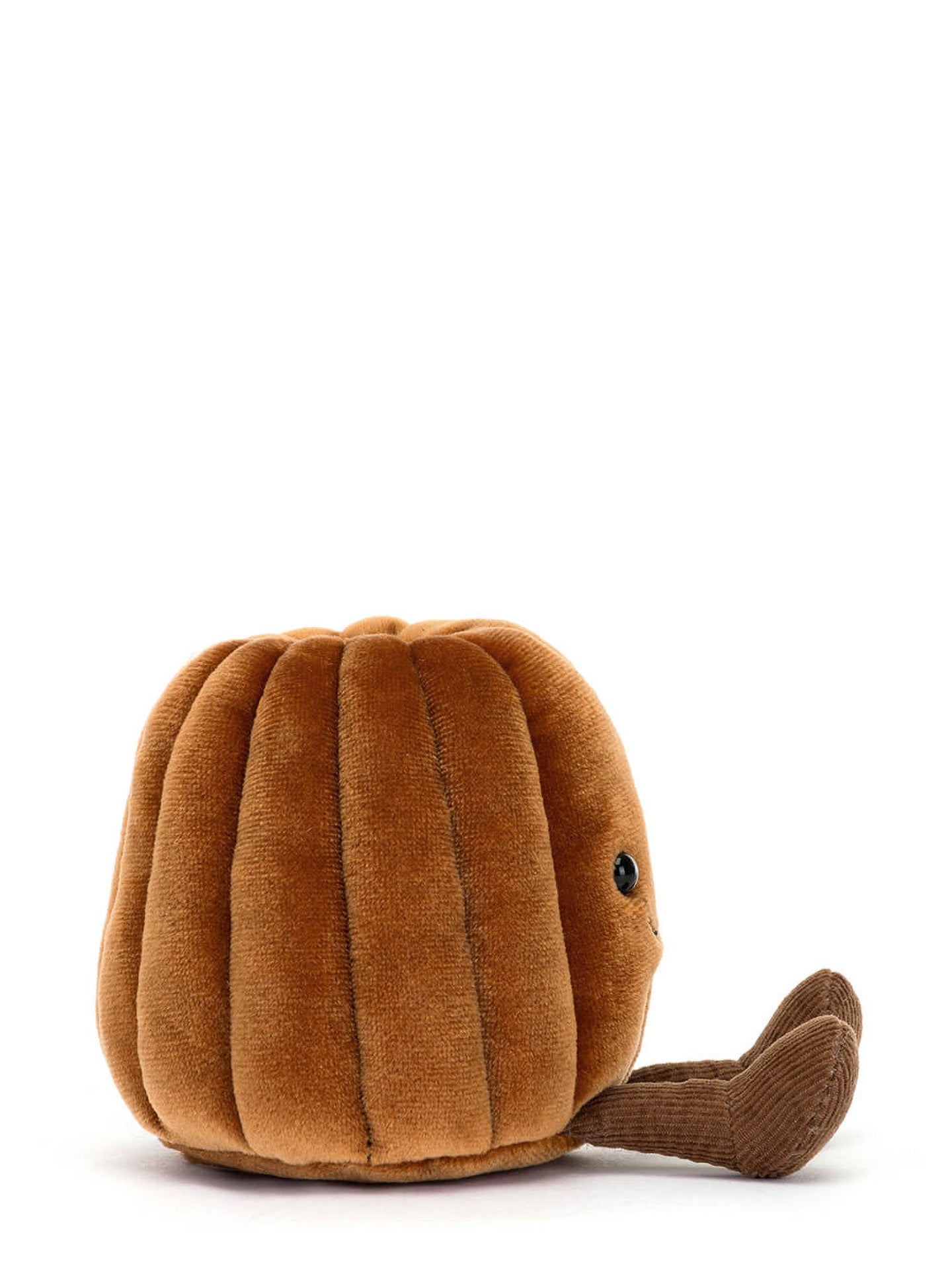 Brown plush toy with little corduroy feet sitting on a white background
