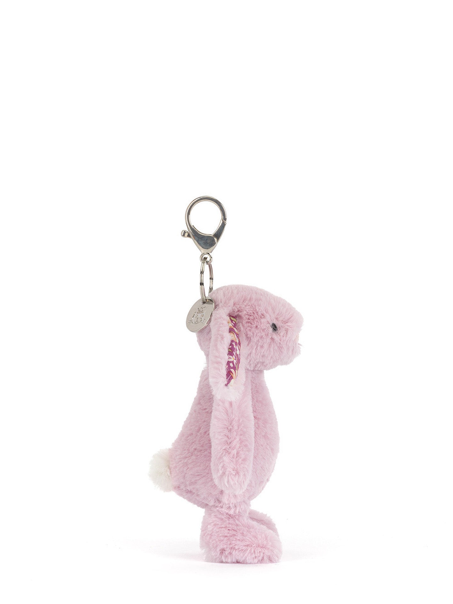 Pink plush bunny keychain with a tag on a white background
