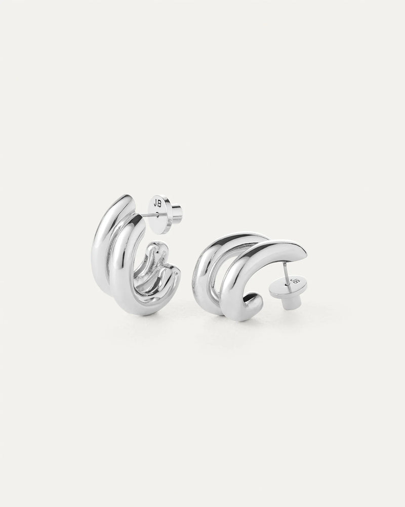 Pair of silver hoop earrings on a white background