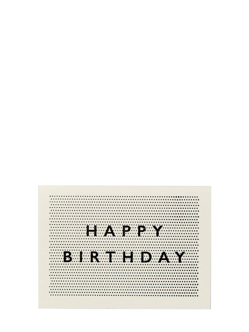 A minimalist square greeting card with a cream background, a black dotted grid pattern, and the words 'HAPPY BIRTHDAY' in black serif letters, shown against a solid white background.