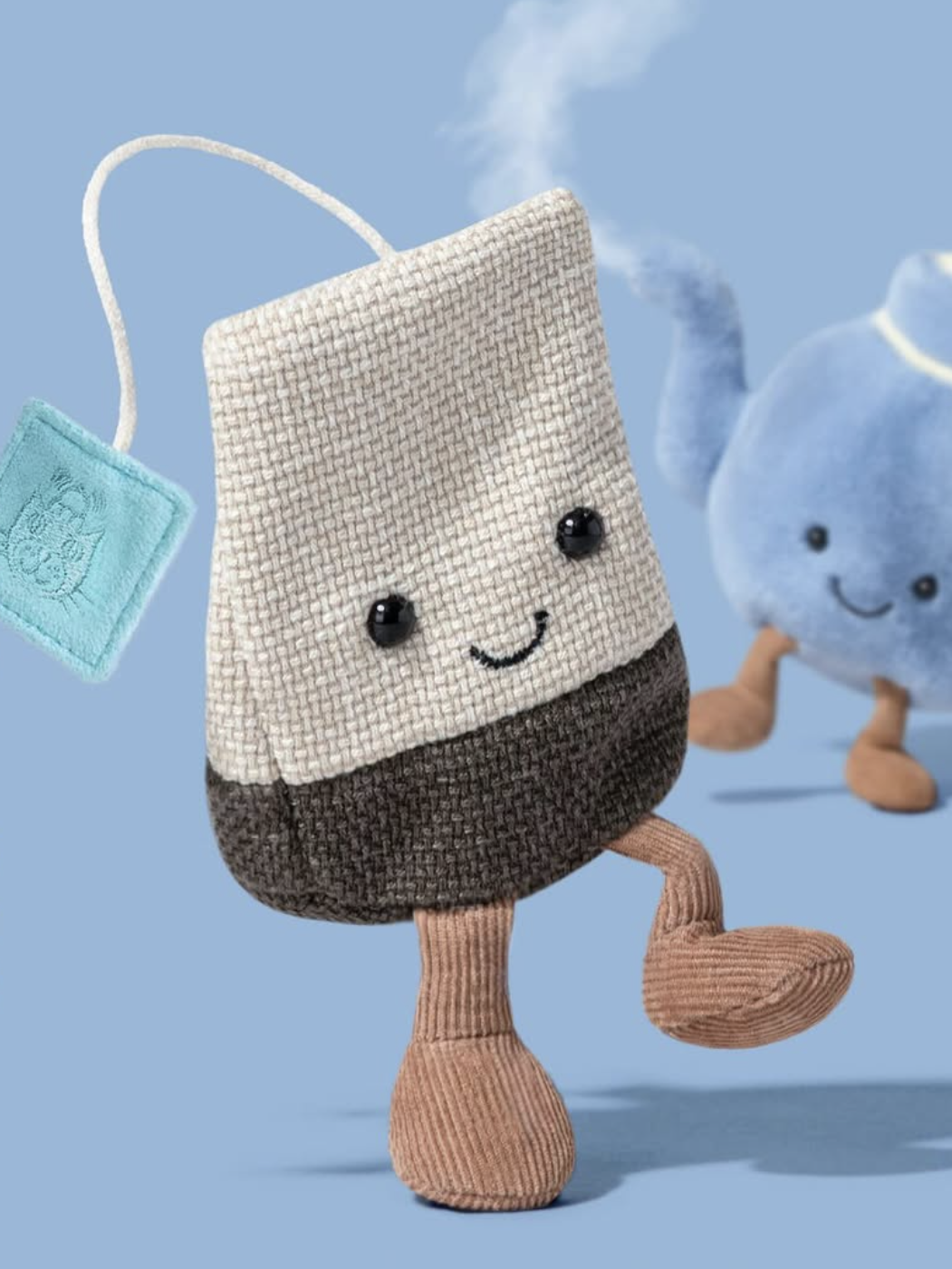 Tea bag toy with a happy face on a blue background