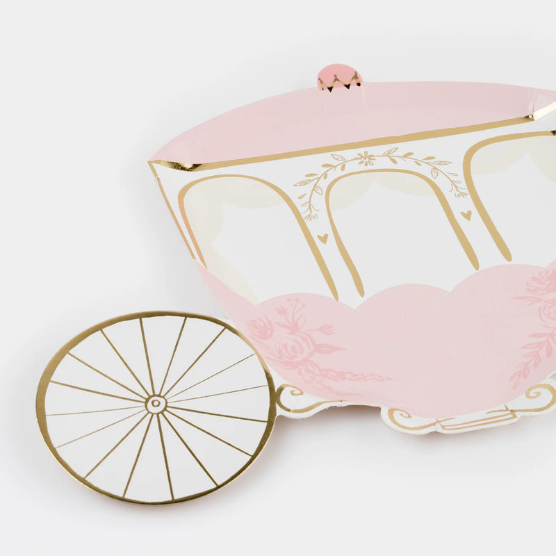 Pink and gold carriage-shaped box on a white background