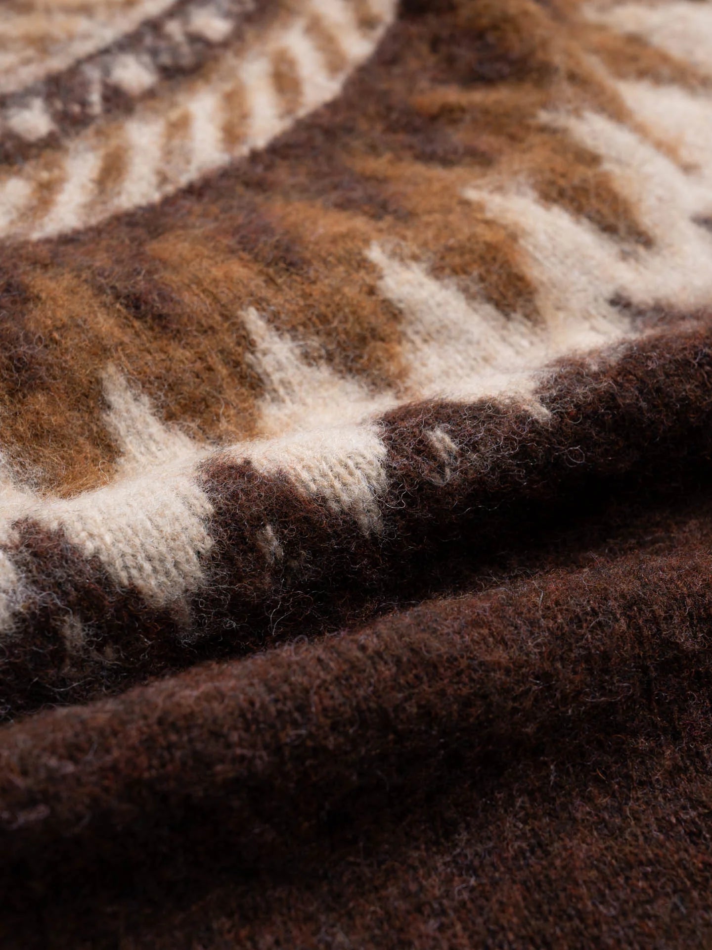 Close-up of a brown fabric with a subtle pattern