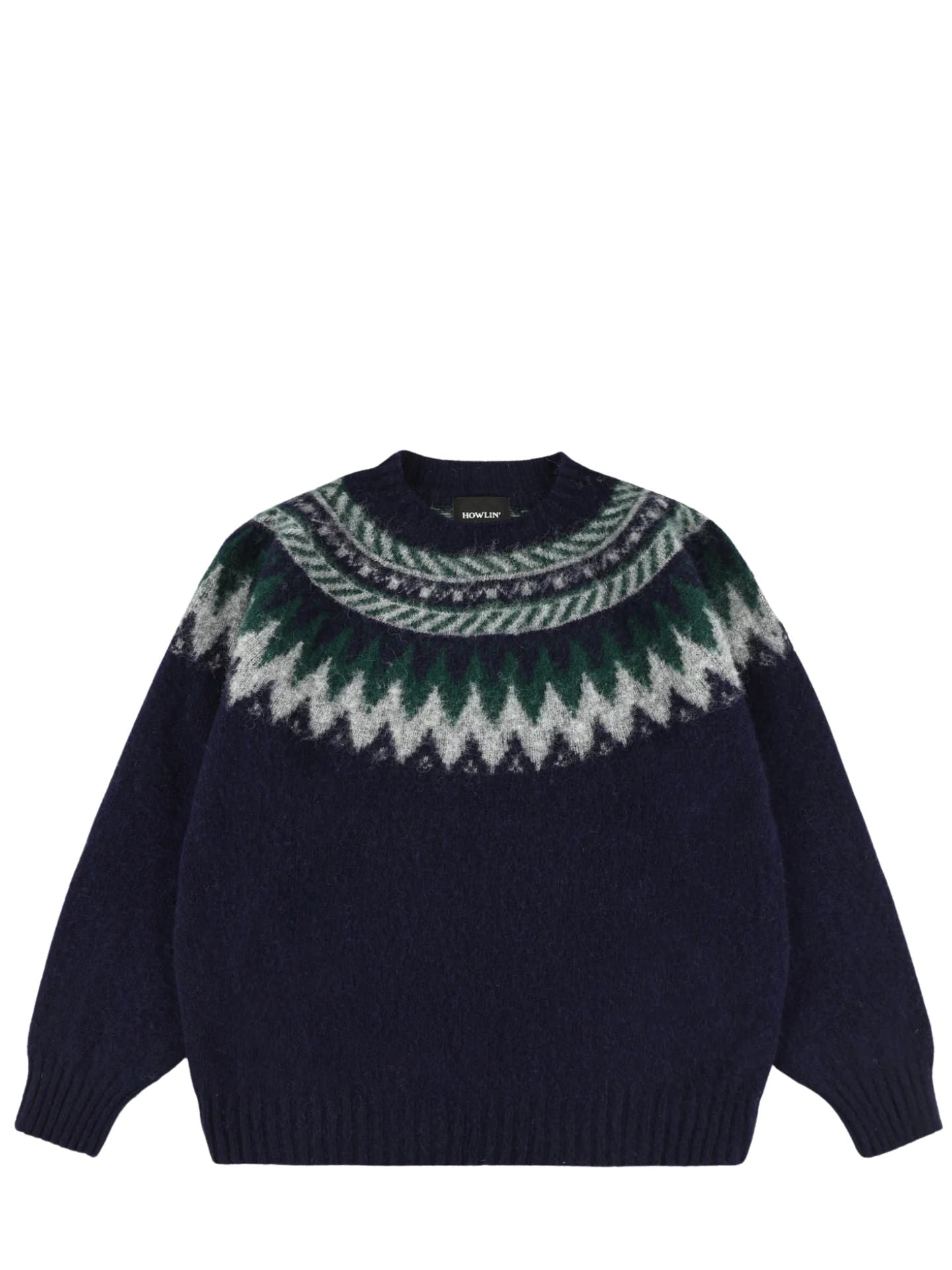 Navy sweater with green and white pattern on a white background